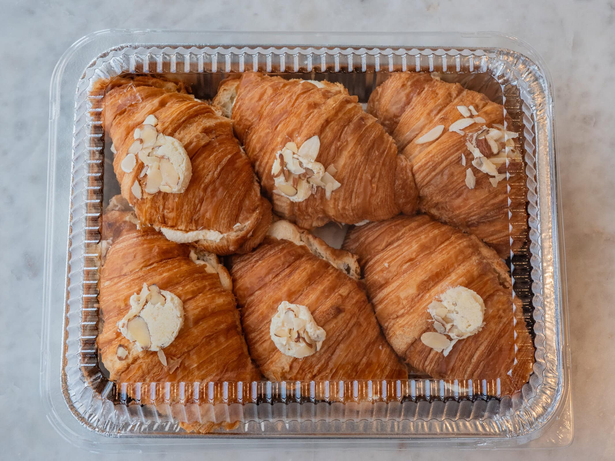 Classic Croissants - Bake At Home Collection The perfect collection for those who want to bake at home with the family, especially during the Holidays. Now you get to take home our classic items and bake them yourself. Fill your home with the smell of freshly baked french croissants. You will definitely feel like a French baker. No one needs to know they came from JL *wink wink. Our classic JL classic croissants are prepared with our house-made croissant dough. Our Bake at Home collection includes 6 raw almond croissants to be baked at home and instructions on how to bake properly. Items should be frozen upon receipt until ready to bake. The product can be moved into your own baking dish before baking. Tag us on Instagram with your baked croissants @JLPATISSERIEAZ! Happy Holidays from the JL team! *CONTAINS DAIRY, EGGS, AND WHEAT*